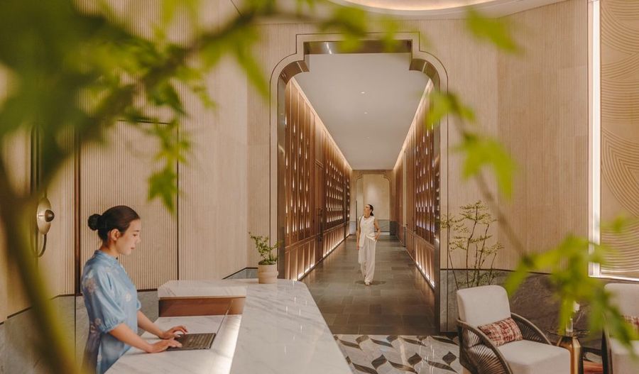 Spa corridor with a guest at reception